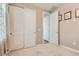 Neutral bedroom with carpet, closet and framed pictures on the wall at 2507 Silent View Ave, Henderson, NV 89044