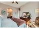 Comfortable bedroom featuring soft lighting, a dresser, and soothing decor at 2507 Silent View Ave, Henderson, NV 89044
