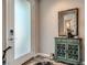 Cozy home entryway with frosted glass door, wood floors, and decorative accents at 2507 Silent View Ave, Henderson, NV 89044