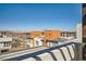 Rooftop view of modern townhomes featuring contemporary designs and desert surroundings against a clear blue sky at 2507 Silent View Ave, Henderson, NV 89044