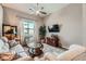 Well-lit living room with comfortable seating and a view of the outdoors at 2507 Silent View Ave, Henderson, NV 89044
