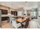 Open-concept living space with modern kitchen, dining area, and comfortable seating at 2507 Silent View Ave, Henderson, NV 89044