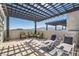 Spacious rooftop patio with mountain views, lounge seating, and shaded pergola at 2507 Silent View Ave, Henderson, NV 89044