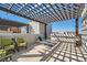 Relaxing rooftop patio with lounge chairs, outdoor seating, and a beautiful trellis covering at 2507 Silent View Ave, Henderson, NV 89044