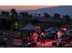Outdoor concert featuring a live band, set against a backdrop of residential homes at 2537 Terrytown Ave, Henderson, NV 89052