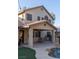 Inviting backyard with covered patio, pool, and well-maintained landscaping at 2549 Sundew Ave, Henderson, NV 89052