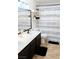 Modern bathroom with double sink vanity and stylish shower curtain at 2549 Sundew Ave, Henderson, NV 89052
