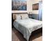 Comfortable bedroom with patterned bedding and tasteful wall art at 2549 Sundew Ave, Henderson, NV 89052