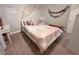 Light filled bedroom boasts pink accents, butterfly decorations, and plush carpeting at 2549 Sundew Ave, Henderson, NV 89052