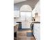 Bright kitchen featuring modern white cabinets, stainless steel appliances and marble countertops at 2549 Sundew Ave, Henderson, NV 89052