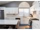 Well-lit kitchen showcasing white cabinets, a marble countertop, stainless appliances, and a large island at 2549 Sundew Ave, Henderson, NV 89052