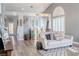 Bright living room with vaulted ceilings, plantation shutters, and wood-look flooring at 2549 Sundew Ave, Henderson, NV 89052