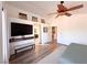 Serene bedroom featuring a ceiling fan, wood-look floors, and ample natural light at 2549 Sundew Ave, Henderson, NV 89052