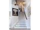 Elegant staircase featuring stylish patterned carpet and striking elephant art at 2549 Sundew Ave, Henderson, NV 89052