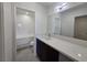 Bathroom featuring a large, bright mirror and a bath tub and shower combo at 3056 Garnet Ct, Las Vegas, NV 89121