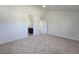 Bedroom with neutral walls and carpet adjacent to bathroom with a dark vanity at 3056 Garnet Ct, Las Vegas, NV 89121