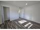 Bedroom showcasing wood-look floors, a closet, and a white door at 3056 Garnet Ct, Las Vegas, NV 89121