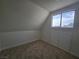 This room features neutral carpet, large windows, and storage with white doors at 3056 Garnet Ct, Las Vegas, NV 89121
