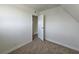 This room boasts neutral carpet, white baseboards, and an open door leading to another room at 3056 Garnet Ct, Las Vegas, NV 89121