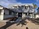 Welcoming two-story home with a decorative front door, manicured landscaping, and a stone pathway at 3056 Garnet Ct, Las Vegas, NV 89121