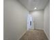 Hallway leads to a room with a mirrored door and white trim and baseboards at 3056 Garnet Ct, Las Vegas, NV 89121