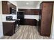Updated kitchen with modern appliances, dark wood cabinets, and new counter tops at 3056 Garnet Ct, Las Vegas, NV 89121