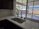 Kitchen sink with a view of the backyard pool at 3056 Garnet Ct, Las Vegas, NV 89121