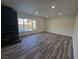 Living room with a fireplace, recessed lighting, and wood-look floors at 3056 Garnet Ct, Las Vegas, NV 89121