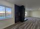 Bright living room with stone fireplace and a window view of the backyard pool at 3056 Garnet Ct, Las Vegas, NV 89121