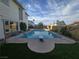 The inviting pool features diving board and ladders for enjoying a refreshing swim in your backyard at 3056 Garnet Ct, Las Vegas, NV 89121