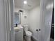 Modern powder room featuring updated vanity, fixtures, and lighting, perfect for guests at 3056 Garnet Ct, Las Vegas, NV 89121