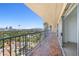 Condo balcony overlooking Las Vegas cityscape, with tile flooring and metal railing at 3111 Bel Air Dr # 24G, Las Vegas, NV 89109