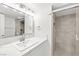 Modern bathroom with a glass-enclosed shower, vanity, and marble countertops at 3111 Bel Air Dr # 24G, Las Vegas, NV 89109