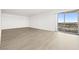 Bright living room features wood floors and a sliding glass door leading to a balcony at 3111 Bel Air Dr # 24G, Las Vegas, NV 89109