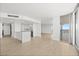 Bright living room features an open floor plan with wood floors, modern lighting, and city views at 3111 Bel Air Dr # 24G, Las Vegas, NV 89109