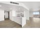 Bright living room features wood floors, modern lighting, and an open floor plan with city views at 3111 Bel Air Dr # 24G, Las Vegas, NV 89109