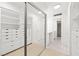 Large walk-in closet with built-in shelving, storage, and wood floors at 3111 Bel Air Dr # 24G, Las Vegas, NV 89109