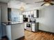 Modern kitchen with stainless steel appliances and a breakfast bar at 3150 Soft Breezes Dr # 1033, Las Vegas, NV 89128