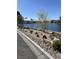 Beautifully landscaped area with various plants, rocks, and a serene water view at 3150 Soft Breezes Dr # 1033, Las Vegas, NV 89128