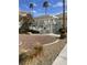 Gated community pool with nearby landscaping at 3150 Soft Breezes Dr # 1033, Las Vegas, NV 89128
