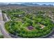 An aerial view showcases the expansive park with mature trees, walking paths and community amenities at 3632 Red Fir St, Las Vegas, NV 89135