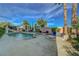 Beautiful backyard oasis with a swimming pool, spa, patio area, and lush landscaping at 3632 Red Fir St, Las Vegas, NV 89135