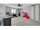 Large carpeted bedroom with a ceiling fan, and a decorative wall art at 3632 Red Fir St, Las Vegas, NV 89135