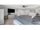 Comfortable bedroom featuring a king size bed, mounted TV, and neutral color palette at 3632 Red Fir St, Las Vegas, NV 89135
