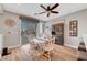 Cozy dining area featuring a white table, patio access, and a decorative hutch at 3632 Red Fir St, Las Vegas, NV 89135
