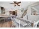 Inviting dining area with seamless flow into a modern kitchen and adjacent staircase at 3632 Red Fir St, Las Vegas, NV 89135