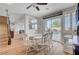 Charming dining area with backyard view, stylish table setting, and hardwood floors at 3632 Red Fir St, Las Vegas, NV 89135