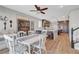 Open-concept dining area flows into a modern kitchen with an adjacent staircase at 3632 Red Fir St, Las Vegas, NV 89135