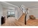 Open concept entryway with wooden floors, stairs and a view of the living room at 3632 Red Fir St, Las Vegas, NV 89135
