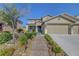 Charming two-story home featuring a three-car garage, neutral paint scheme and rock landscaping at 3632 Red Fir St, Las Vegas, NV 89135